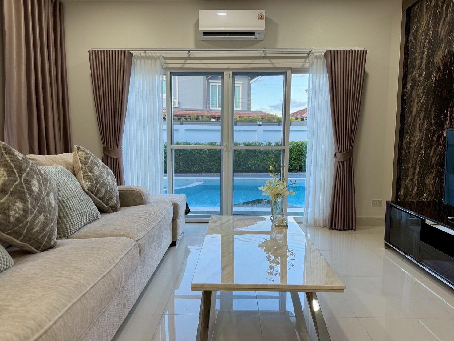 Living room with pool view