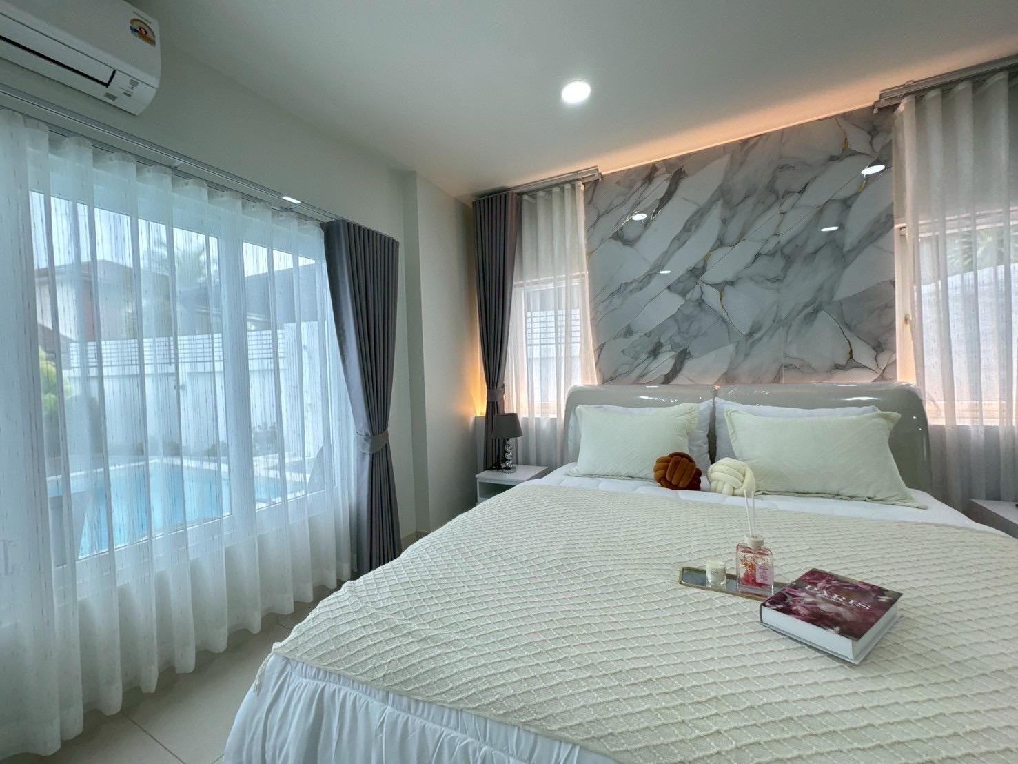 Bedroom with pool view